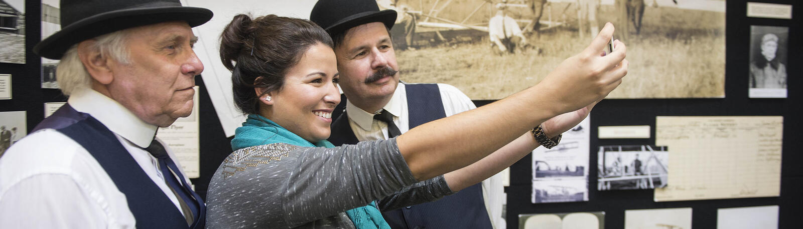 photo of a student and wright bros lookalikes at wright brothers day