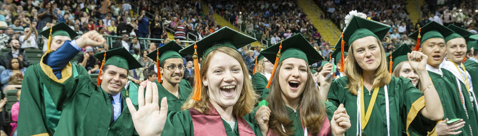 photo of happy graduates at a wright state commencement ceremony