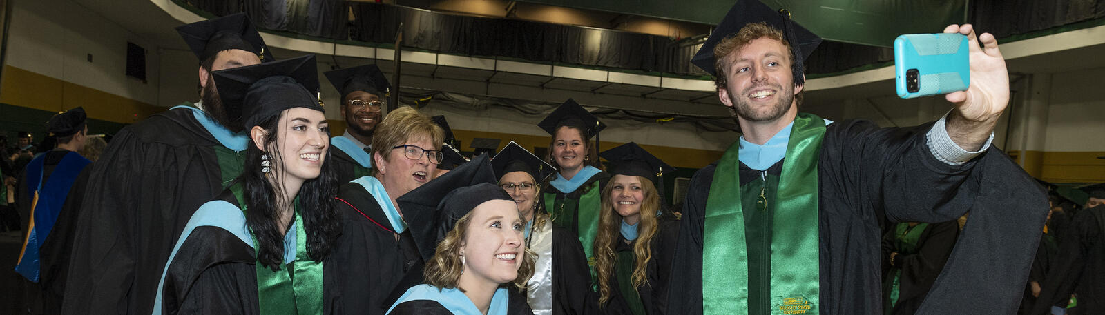photo of happy graduates at a wright state commencement ceremony