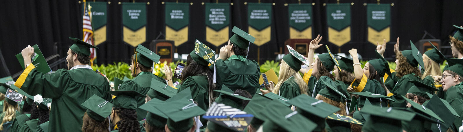 photo of happy graduates at a wright state commencement ceremony