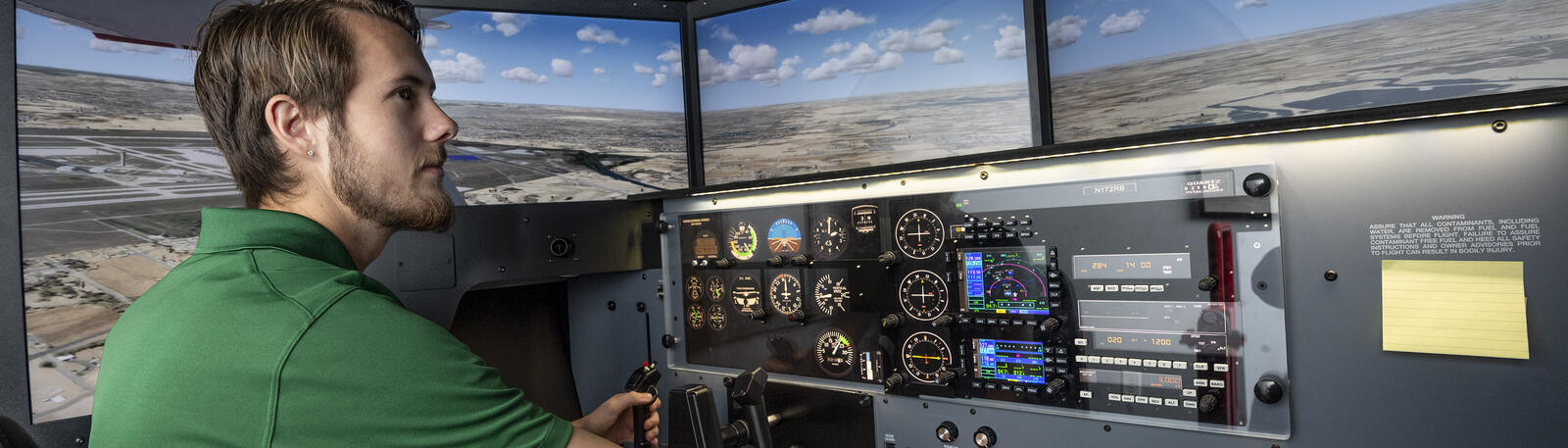 aviation student in a flight simulator