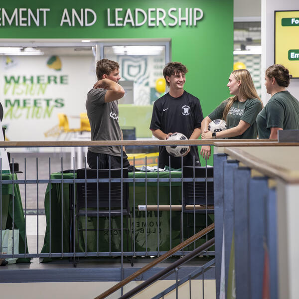 students standing outside of the student involvement and leadership center