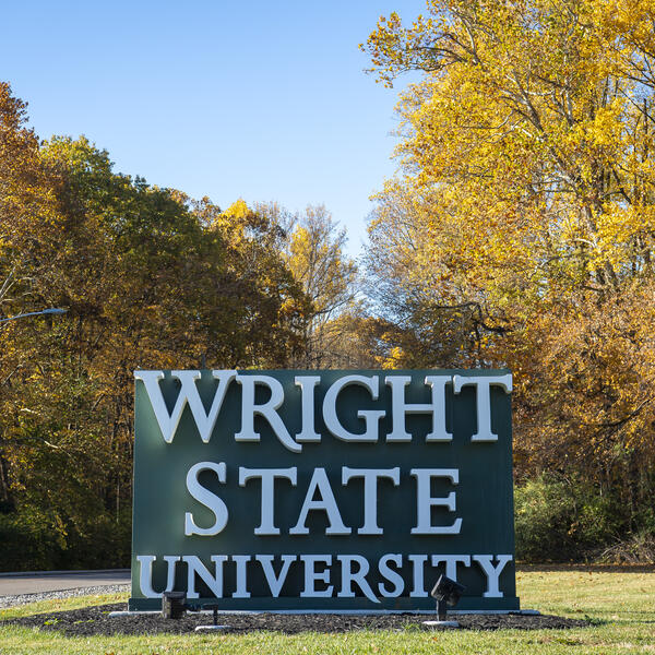 wright state university sign in front of beautiful trees in the fall