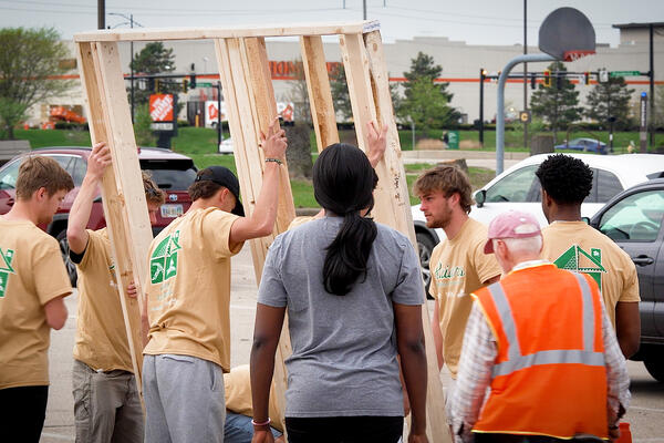 Wright State student-athletes help build Fairborn home for family seeking homeownership