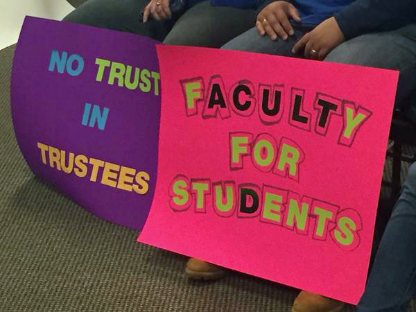 Faculty protest signs