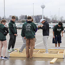 photo of students working on a building project