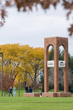 photo of people walking near alumni tower