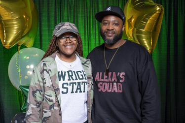 photo of a student and parent at an event on campus