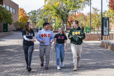 photo of students walking outside on campus