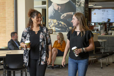 photo of a student and advisor talking