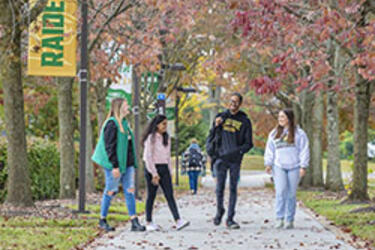 photo of students walking outside on campus