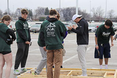 photo of students working on a building project