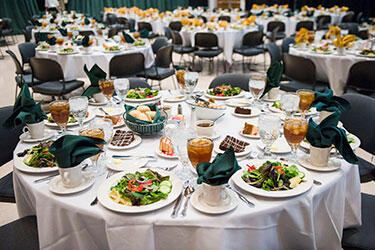 photo of tables set at a catering event