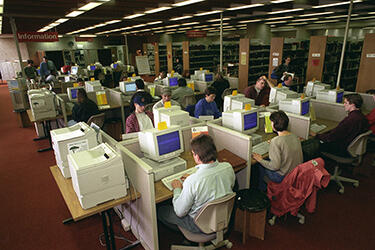 photo of students in the library using computers
