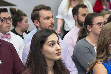 photo of a group of people sitting in a meeting room
