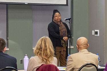 photo of a student speaking at the Three Minute Thesis/Dissertation Competition