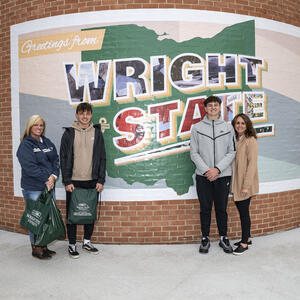 students and their moms posing for a photo at wright state