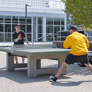 students playing table tennis outside at wright state