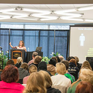 photo of a lecturer and audience