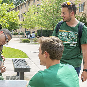 photo of a housing employee giving keys to a resident