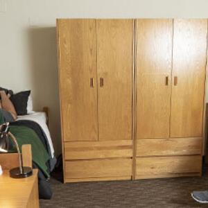 photo of two students in a dorm room in The Woods