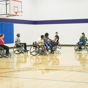 Photo of student playing football 