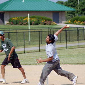 photo of student playing cricket 