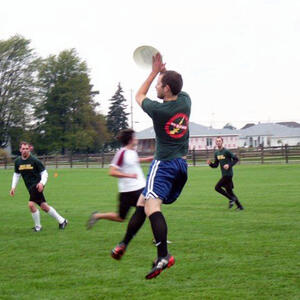 photo of student playing on the ground 