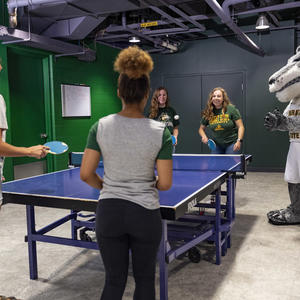 photo of students playing table tennis in the student union