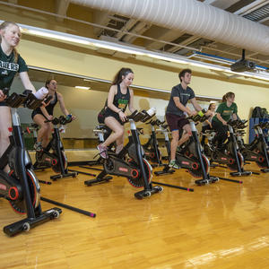 photo of people in a cycling class
