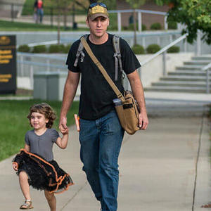 Students walking on campus with daughter