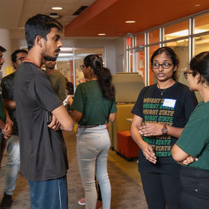 photo of students talking at a meet and greet event